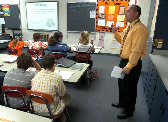Harbor Creek Junior High School teacher Patrick Bruce leads a seventh-grade life sciences class Aug. 31, 2007. Bruce decided to become a teacher after the events of Sept. 11, 2001.