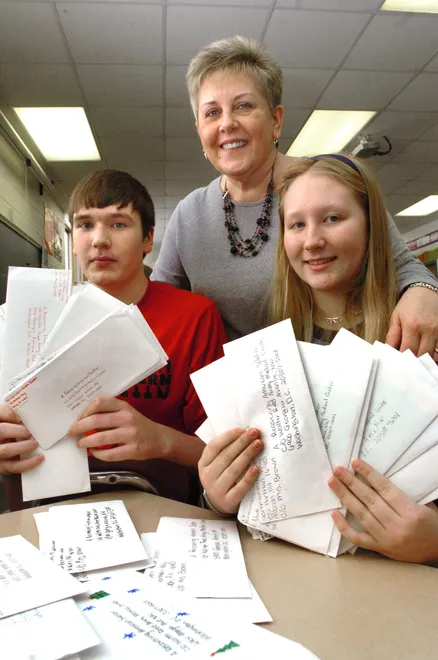 Northwestern Middle School eighth-grade teacher, Mary Ann Brown and students Jimmy Hemmis, 13, and Rylee Shaffer, 14, on Jan. 2, 2008, with some of the 150 letters students mailed to Walter Reed Medical Center in Washington, D.C. The letters were returned unopened because the military does not accept letters that aren't addressed to a specific soldier.