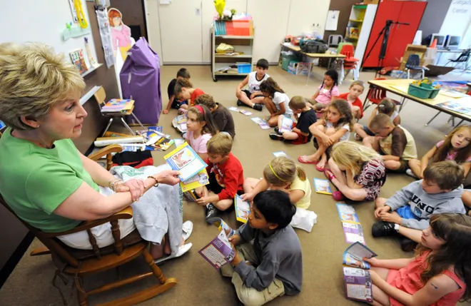 Grandview Elementary School first-grade teacher Jeanne Szymanowski, left, talks with her class about the Summer Olympics on the students' last day June 10, 2008. Szymanowski was retiring after more than 30 years of teaching in the Millcreek School District.