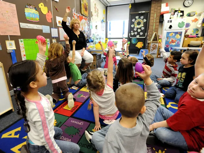 Grandview Elementary Preschool teacher Debi Little asks her students to show their plastic Easter eggs during a learning session at the school April 3, 2009.