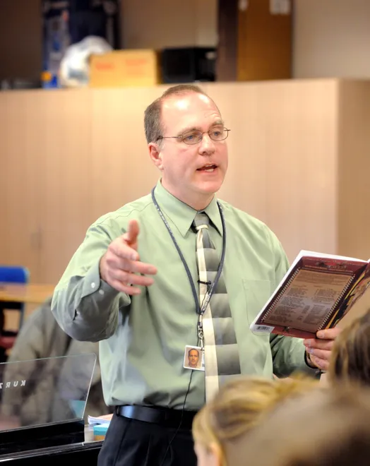 Westlake Middle School music teacher Andrew Gross leads his class through voice drills Feb. 26, 2009.