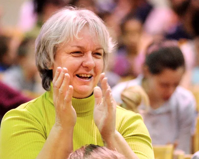 Dr. Gertrude A. Barber National Institute teacher Denise Stoutamyre applauds the students who acted in the play "Dream" during dress rehearsal at the center March 25, 2009.