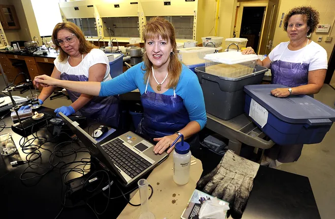 Science teachers, from left, Doreen Petri, of Northwest Pennsylvania Collegiate Academy; Wendy Mangol, of Union City; and Diane MacWilliams, of McDowell Intermediate demonstrate lab devices that measure the quantity of energy in food July 16, 2010, at the Zurn Science Center at Gannon University in Erie. The lab materials are part of a mobile science lab called Science In Motion.