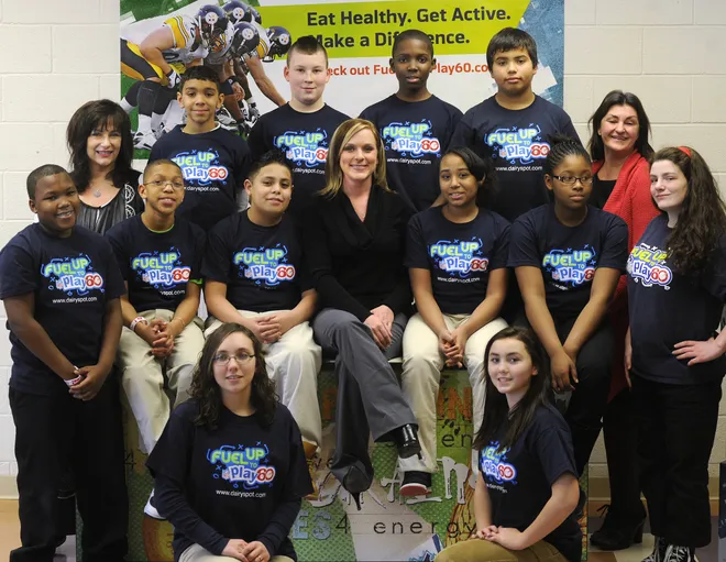 Harding School teacher Emily Natalie, center, won a trip to the NFL Pro Bowl in Hawaii for her work with the "Fuel Up to Play 60" campaign. Natalie was photographed at the Erie school on Jan. 26, 2011, with team members, from left, kneeling, Daryn Bailey, 13, Meghan Erdely, 14. Middle row, from left, Elijah Smart, 14, Roman DeBerry, 12, Gorge Amadora, 12, Natalie, Lamariyia Lomax, 11, Alyssa Jones, 12, and Ryan Watt, 13. Back row, from left, teacher Jo Marie Boesch, James Jackson, 10, Jared Doutt, 13, Aaron Copeland, 13, Lucas Harden, 12, and teacher Judy Goetschius.