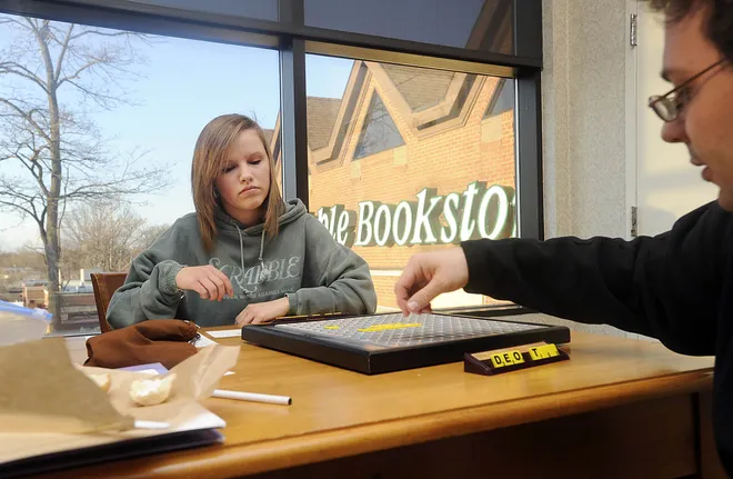 Harding School eighth-grader Johanna Balzer, 14, plays Scrabble against her teacher Bryan Lewis during a local Scrabble club gathering at Barnes & Noble Bookstore on April 5, 2011. Balzer and another Harding eighth-grader, Samantha Cortes, were preparing for a trip to Florida for the children's Scrabble championship.