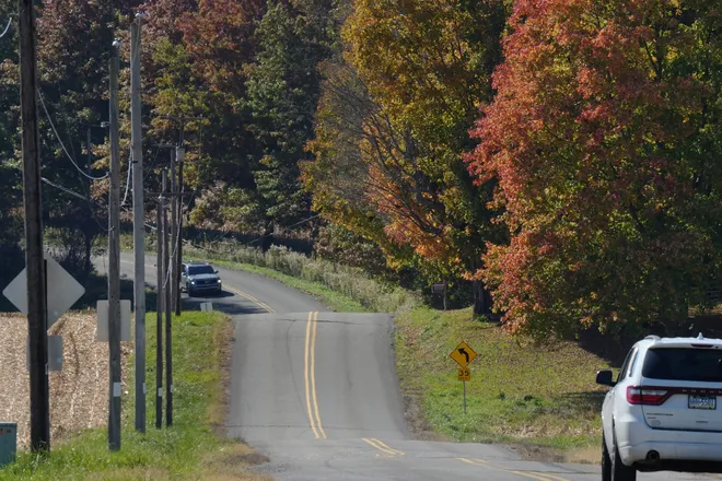 Leaves start to turn color along Sharp Road in Erie County, Pa., on Oct. 20, 2026.