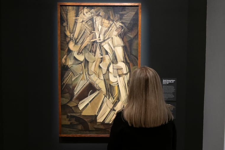 A visitor looks at Marcel Duchamp's "Nude Descending a Staircase (No. 2)" on exhibit at the Philadelphia Museum of Art in Philadelphia on Thursday, Oct. 8, 2026.