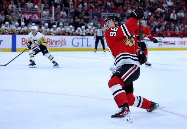 Chicago Blackhawks center Connor Bedard (98) follows through on a shot in the first period of a game against the Pittsburgh Penguins at the United Center in Chicago on Oct. 13, 2026. (Chris Sweda/Chicago Tribune)