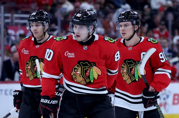 Chicago Blackhawks right wing Patrick Kane (88), right wing Roman Kantserov (80), and center Connor Bedard (98), stand on the ice in the first period of a game against the Pittsburgh Penguins at the United Center in Chicago on Oct. 13, 2026. (Chris Sweda/Chicago Tribune)