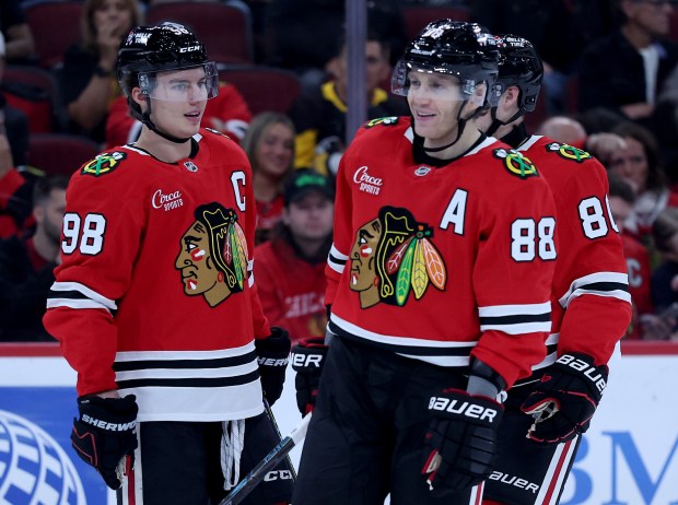 Chicago Blackhawks center Connor Bedard (98) and right wing Patrick Kane (88) stand on the ice in the first period of a game against the Pittsburgh Penguins at the United Center in Chicago on Oct. 13, 2026. (Chris Sweda/Chicago Tribune)