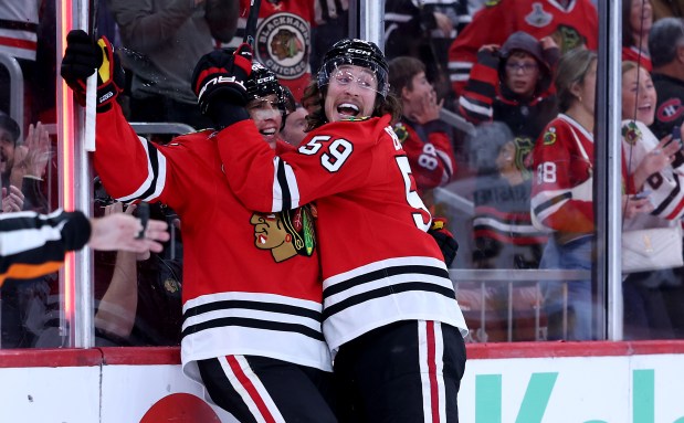 Chicago Blackhawks left wing Tyler Bertuzzi (59) celebrates with center Teuvo Teravainen (86) after Teravainen scored a goal in the third period of a game against the Pittsburgh Penguins at the United Center in Chicago on Oct. 13, 2026. (Chris Sweda/Chicago Tribune)