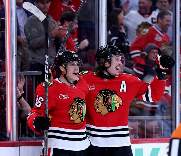 Chicago Blackhawks center Teuvo Teravainen (86) and left wing Tyler Bertuzzi (59) celebrate after Teravainen scored a goal in the third period of a game against the Pittsburgh Penguins at the United Center in Chicago on Oct. 13, 2026. (Chris Sweda/Chicago Tribune)