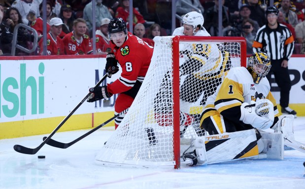 Chicago Blackhawks center Ryan Donato (8) makes a move around the net in the third period of a game against the Pittsburgh Penguins at the United Center in Chicago on Oct. 13, 2026. (Chris Sweda/Chicago Tribune)