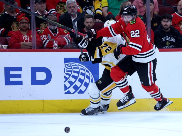 Chicago Blackhawks right wing Cole Smith (22) chases after the puck in the third period of a game against the Pittsburgh Penguins at the United Center in Chicago on Oct. 13, 2026. (Chris Sweda/Chicago Tribune)