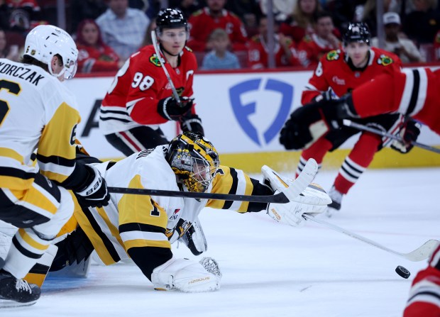 Pittsburgh Penguins goaltender Sergei Murashov (1) makes a save in the third period of a game against the Chicago Blackhawks at the United Center in Chicago on Oct. 13, 2026. (Chris Sweda/Chicago Tribune)