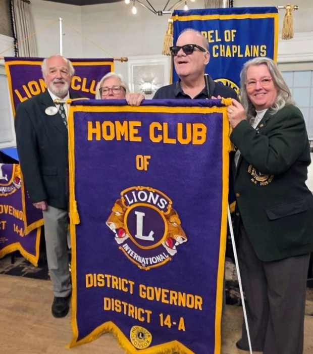 The Lions' District Governor Larry Healy, left, is with, from left, Springfield Lions President Lisa Tiffany, Lion Jim from the Philadelphia Northeast Lions Club, and Past District Governor Theresa Kuhar of the Philadelphia Northeast Lions Club. (COURTESY OF SPRINGFIELD LIONS CLUB)