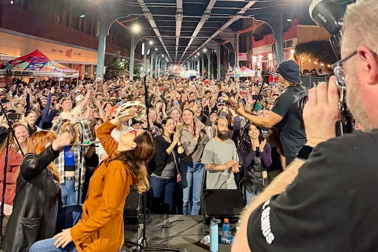 Members of Wheatus play to a crowd of more than 3,000 people outside of Evil Genius Brewing Company on Front Street.