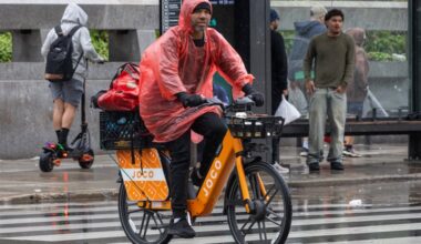 A delivery driver rides across John F. Kennedy Boulevard near Love Park during last weekend's nor'easter. Big changes may be in the winds.