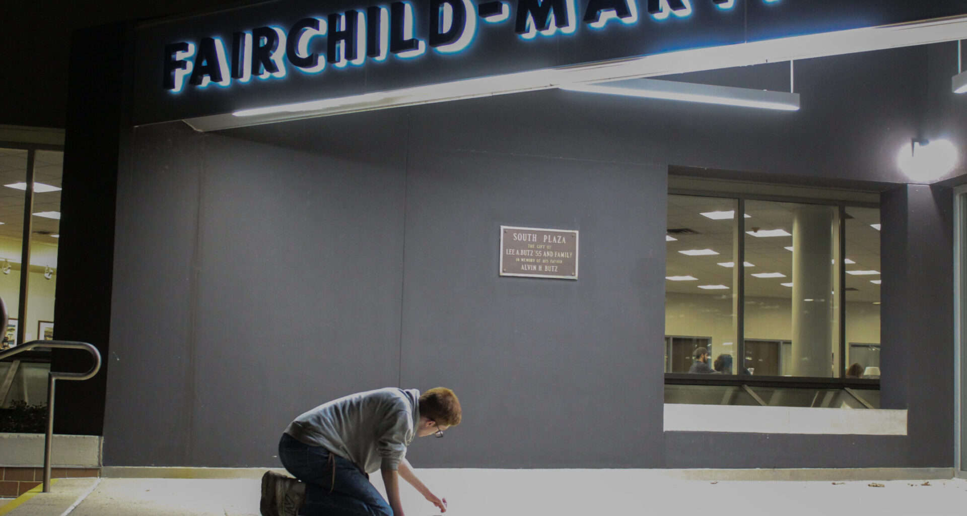 Students for Life chalk outside FML, dissenters pour water