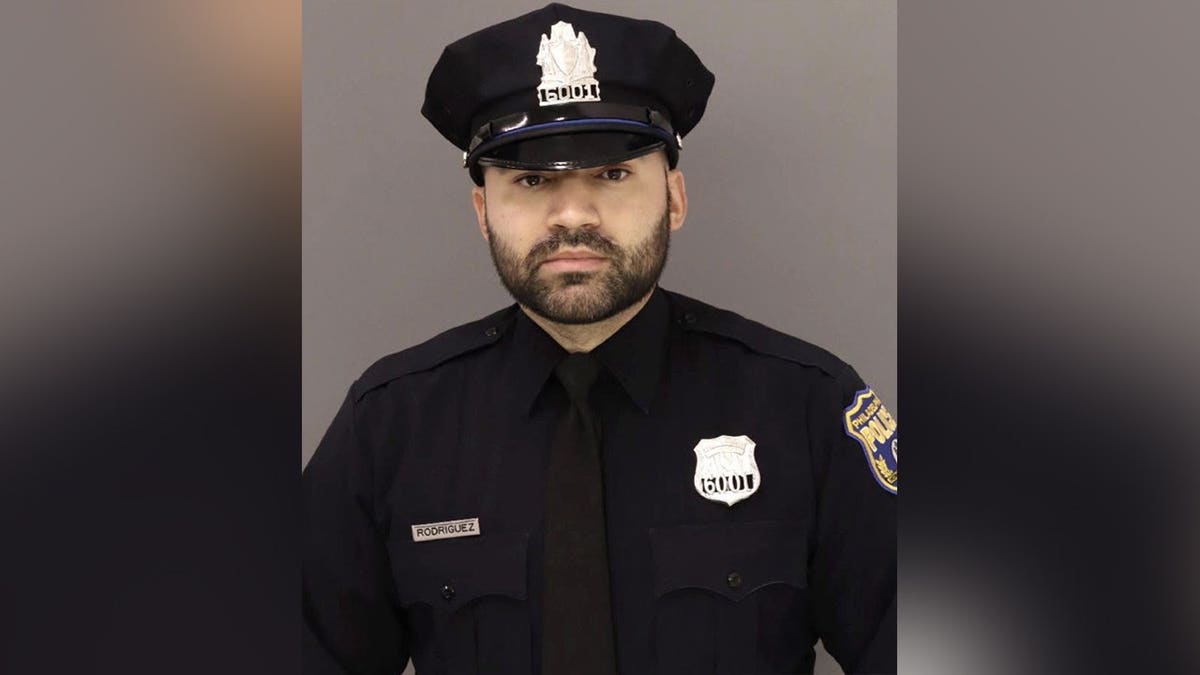 Philadelphia Police Officer Hector Rodriguez III poses for an official department photo in uniform.
