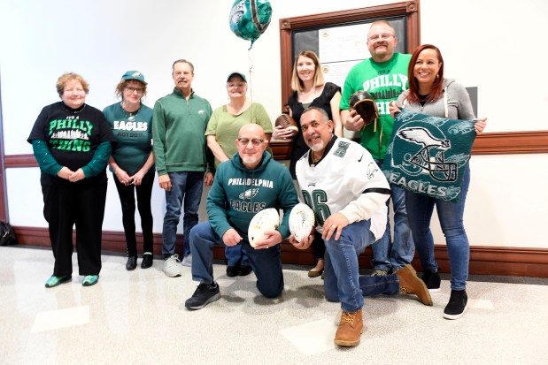 Reading Mayor Eddie Moran and part time staff assistant Joe Ayala with City Hall staff show their Eagles green Friday. (BILL UHRICH-READING EAGLE)