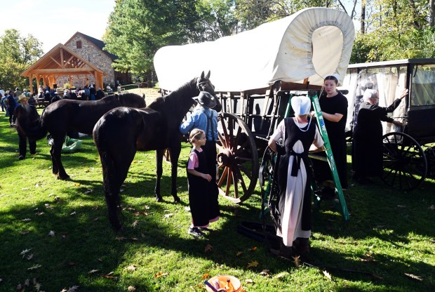A caravan of horse-drawn wagons and buggies set out from Gordon, Lancaster County, on Thursday at the Nicholas Stoltzfus Homestead in Wyomissing on Saturday, Oct. 3, 2026. (BILL UHRICH/READING EAGLE)
