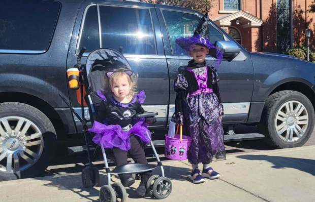 Raelynn Smith, 2, and her sister Delilah Smith, 6, donned "a witch and her cat" costumes for a Fall Festival in downtown Scranton on Saturday, Oct. 24, 2026. Their mom, Becky Smith, said the family, from Olyphant, enjoyed the chance to spend a day in downtown Scranton filled with fun and activities. (GERI GIBBONS/STAFF PHOTO)