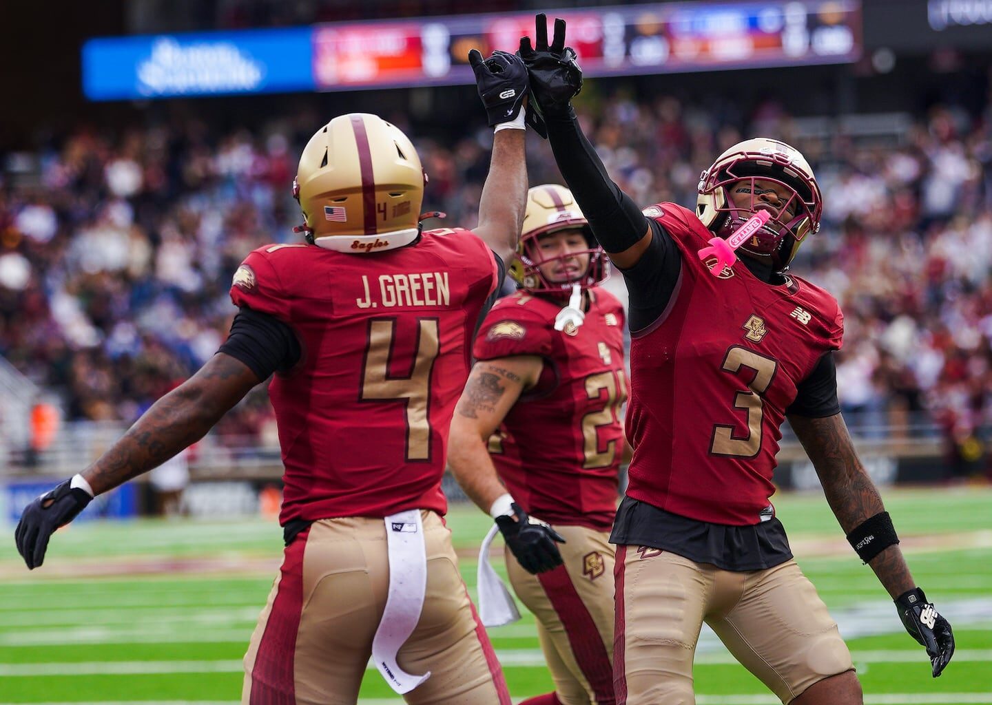 Javarius Green caught an 11-yard touchdown pass to put Boston College in front late in the second quarter and celebrated with fellow wide receiver Dawson Pough (right).