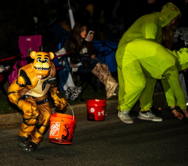 Families enjoy the candy, sights and sounds Wednesday, Oct. 21, 2026, during the Catasauqua-North Catasauqua Halloween Parade. (April Gamiz/The Morning Call)