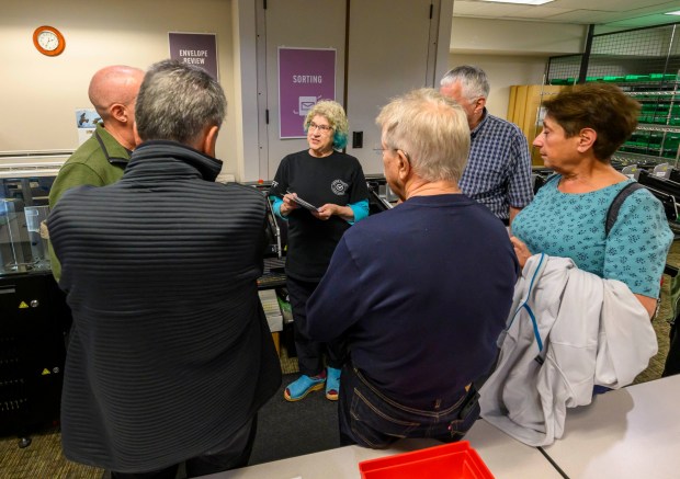 Lehigh County employee Andrea Lerner explains the ballot-counting process to attendees Thursday, Oct. 8, 2026, during the county voter registration office's first open house, at the government center in Allentown. The open house gave the public a look at where mail-in ballots are opened, processed and counted and the tabulation equipment used during elections, and learn more about how the equipment operates and how the election process comes together. (April Gamiz/The Morning Call)
