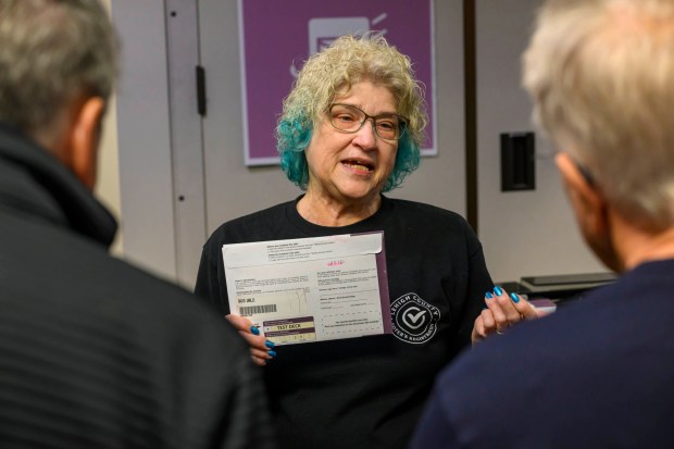 Lehigh County employee Andrea Lerner explains the ballot-counting process to attendees Thursday, Oct. 8, 2026, during the county voter registration office's first open house, at the government center in Allentown. The open house gave the public a look at where mail-in ballots are opened, processed and counted and the tabulation equipment used during elections, and learn more about how the equipment operates and how the election process comes together. (April Gamiz/The Morning Call)