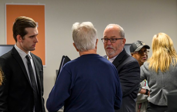 Lehigh County elections chief Mike Paston and county Executive Josh Siegel speak with attendees Thursday, Oct. 8, 2026, during the Lehigh County voter registration office's first open house, at the government center in Allentown. The open house gave the public a look at where mail-in ballots are opened, processed and counted and the tabulation equipment used during elections, and learn more about how the equipment operates and how the election process comes together. (April Gamiz/The Morning Call)