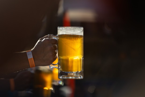 People competes in the stein-holding competition Saturday, Oct. 3, 2026, during Oktoberfest at SteelStacks in Bethlehem. The annual festival continues Oct. 9-11, 2026. (Mackenzie McGovern/Special to The Morning Call)