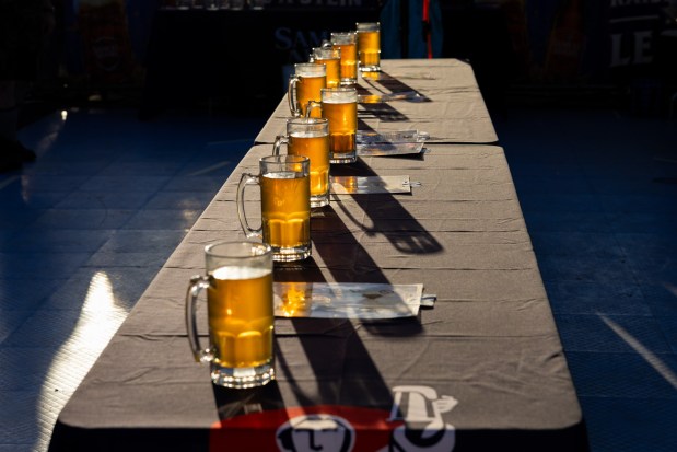 People competes in the stein-holding competition Saturday, Oct. 3, 2026, during Oktoberfest at SteelStacks in Bethlehem. The annual festival continues Oct. 9-11, 2026. (Mackenzie McGovern/Special to The Morning Call)