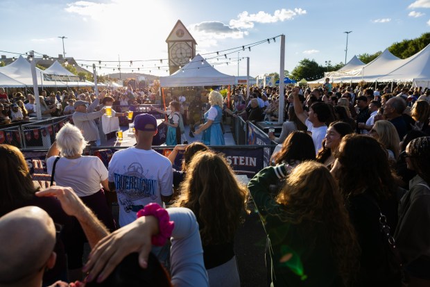 People competes in the stein-holding competition Saturday, Oct. 3, 2026, during Oktoberfest at SteelStacks in Bethlehem. The annual festival continues Oct. 9-11, 2026. (Mackenzie McGovern/Special to The Morning Call)