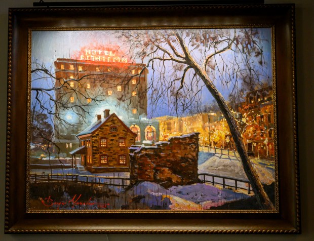 A painting of the 1761 Tannery, left, and 1869 Luckenbach Mill by Sergei Yaralov,  one of four recently installed in the main dining room of Kirkland Village, is seen Friday, Oct. 2, 2026, in Bethlehem. Residents donated money to purchase the art, part of a collection of over 800 pieces. The Tannery produced leather from the hides of butchered animals. The building contained vats for tanning and dyeing and a large, ventilated room for drying tanned hides. The Luckenbach Mill was built over the remains of an eighteenth-century water-powered grist mill. (April Gamiz/The Morning Call)