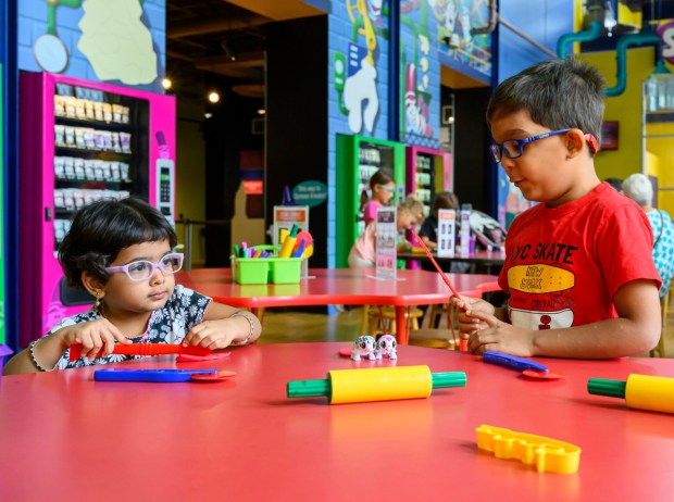 Maya, 2, and Ojas, 6, play at the Scribble Scrubbie area Monday, Sept. 23, 2024, during the Screamin' Green Hauntoween at Crayola Experience in Easton. Screamin' Green Hauntoween, a Halloween-themed event with a scavenger hunt, crafts and photo opportunities, runs through Oct. 31. (April Gamiz/The Morning Call)