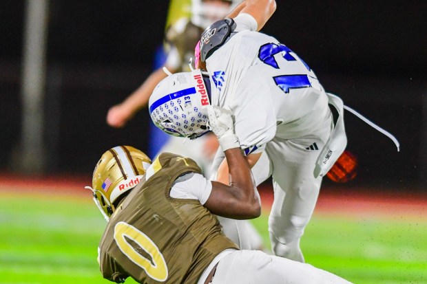 Nazareth's Luke Depietro gets dragged down against Bethlehem Catholic's Great Chifirst on Saturday, Oct. 17, 2026, BASD Stadium in Bethlehem. (Jonathan Broady/Special to The Morning Call)