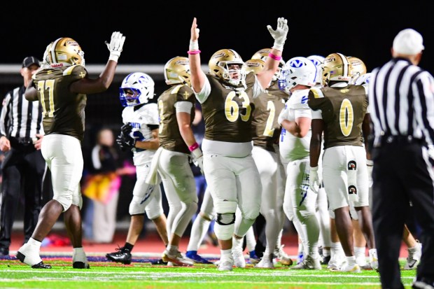 Bethlehem Catholic's Joey Daleo celebrates a touchdown by Axel Burkart against Nazareth on Saturday, Oct. 17, 2026, BASD Stadium in Bethlehem. (Jonathan Broady/Special to The Morning Call)