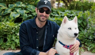 Elias Weiss Friedman, photographer and founder of the Dogist, posed for a portrait with his dog Elsa in his childhood neighborhood on May 20, 2025, in Narberth. On Sunday Oct. 4, Friedman will lead a group dog walk along the Schuylkill Banks in Philadelphia.