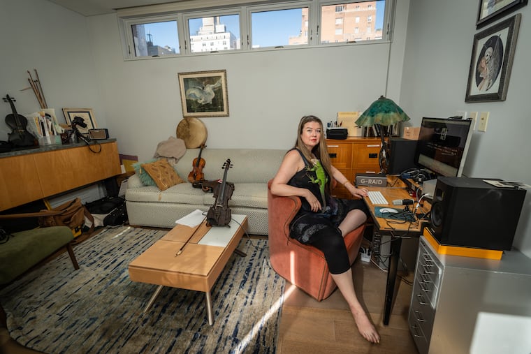 Lara St. John, in her home office/editing suite where she worked on her documentary film, "Dear Lara," with her pet iguana, Octavius, in New York City on Sept. 10, 2024.