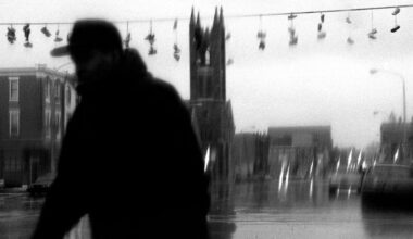 In this photo from March 23, 2000, a man walks through the rain in Northeast Philadelphia.