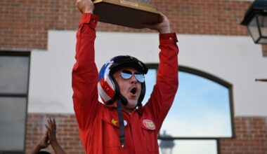 Mario "One-Shot Mar" Zucca hoists the trophy he received Saturday for winning the first Philadelphia Parallel Parking Championship at Headhouse Plaza.