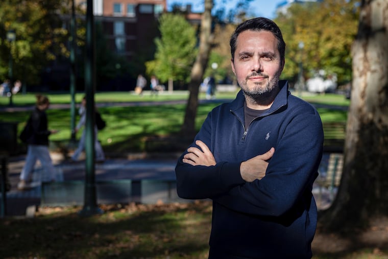 Professor Zeke Hernandez stands for a portrait at the University of Pennsylvania campus in Philadelphia on Thursday, Oct. 15, 2026. Hernandez has researched how local economies are affected by ICE arrests and found that foot traffic and spending drop significantly after an arrest is made in that area.