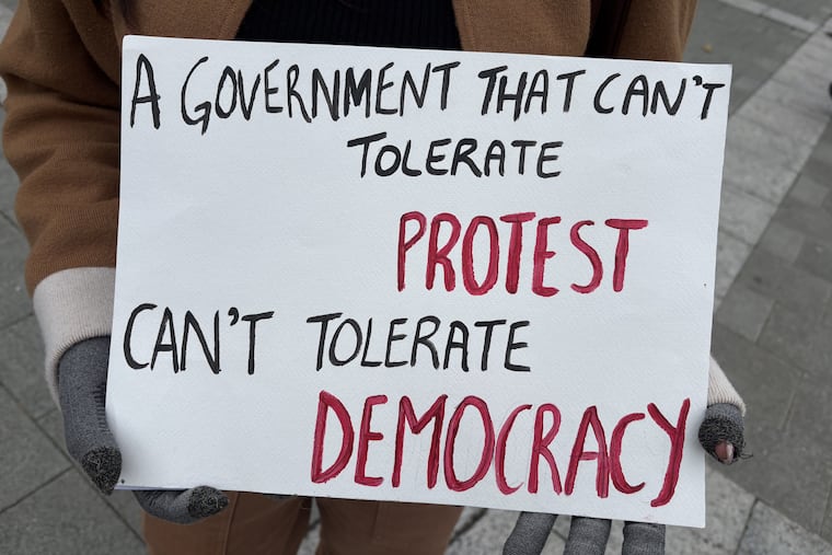 A demonstrator holds up a sign at a protest on Saturday, Oct. 17, 2026, at the Philadelphia Art Museum steps, decrying election manipulation in India.