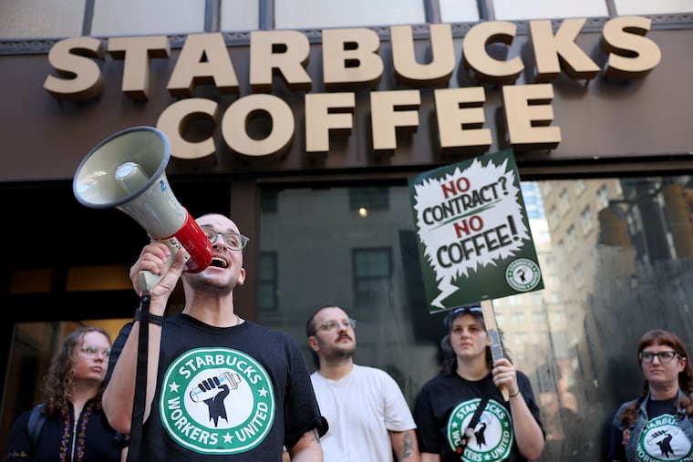 In this 2025 file photo, Teddy Guerra, a Starbucks employee at 20th and Market, speaks during a Starbucks Workers United rally outside the shop at 16th and Walnut. City Council this week approved legislation to support a nationwide boycott of Starbucks amid a unionization effort.