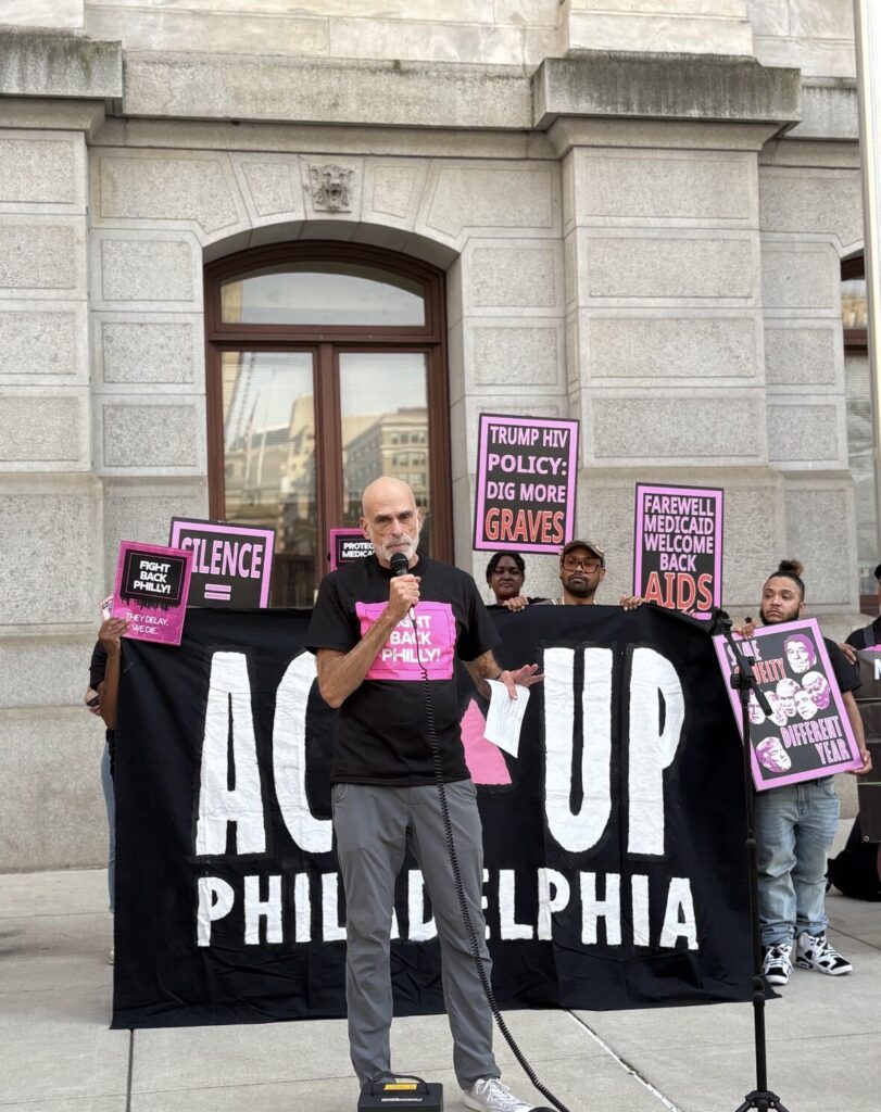 Tom Hennes, founder of ThincDesign, speaks to a crowd outside of Philadelphia City Hall