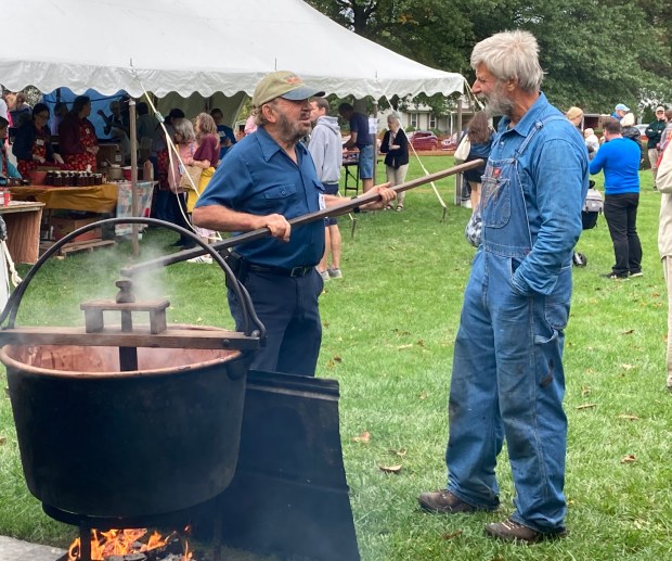 Harry Bauman of Bauman Family Apple Butter demonstrates traditional apple butter stirring at the 50th annual Apple Butter Frolic. (John Worthington/MediaNews Group)