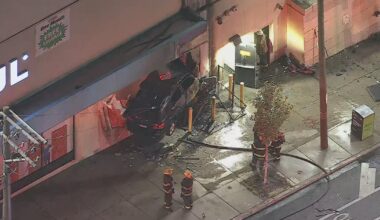 1 dead after car crashes into U-Haul building in Kensington, sparking large fire, police say