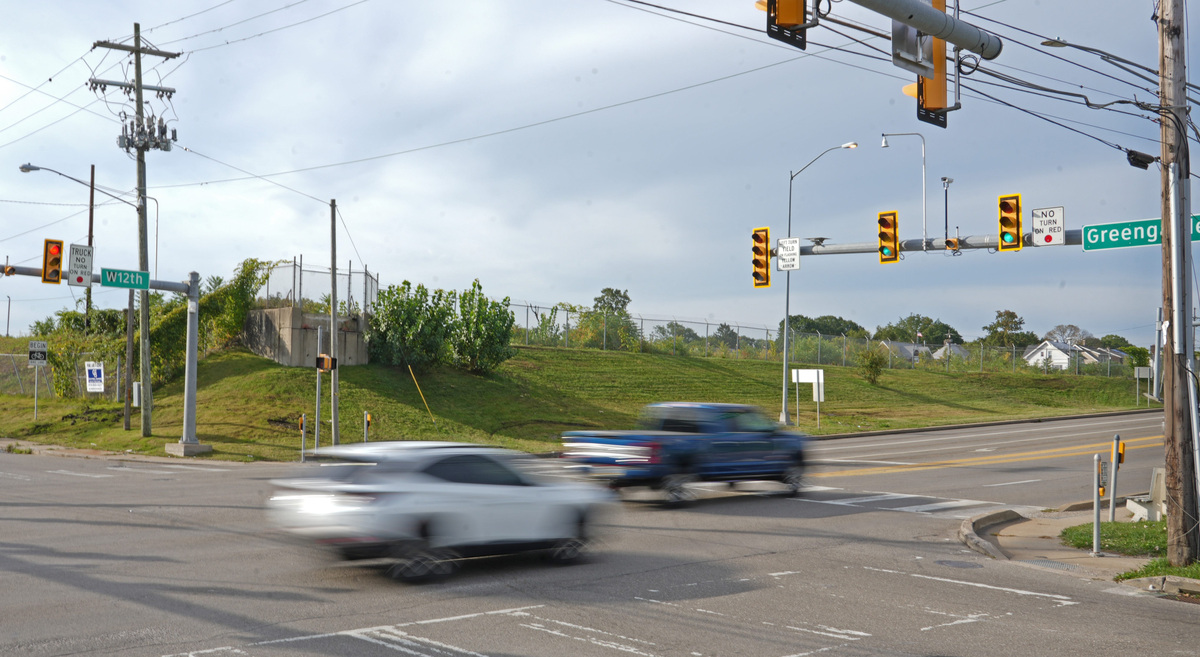 Traffic passes at the corner of West 12th Street and Greengarden Road.